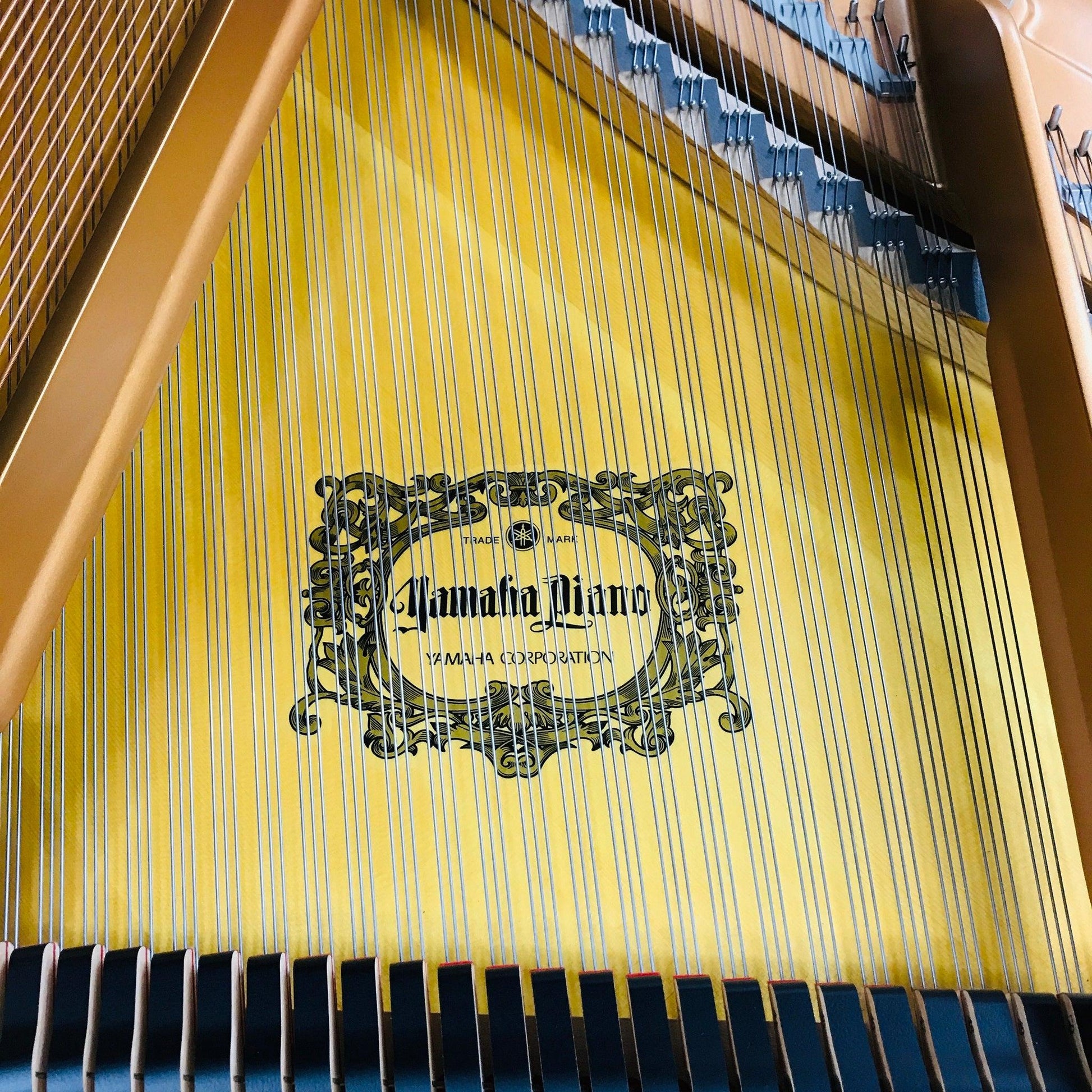 yellow grand piano